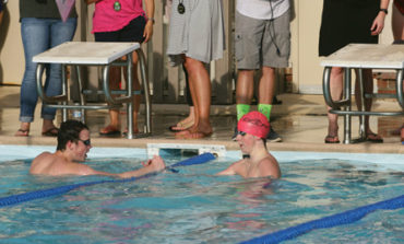 Sharks swim strong at season opener