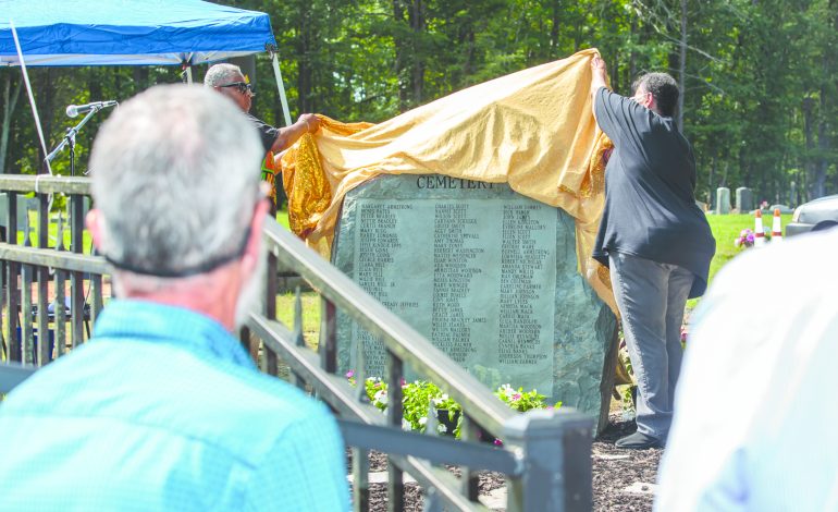 Memorial dedicated listing names of people buried at Oak Hill